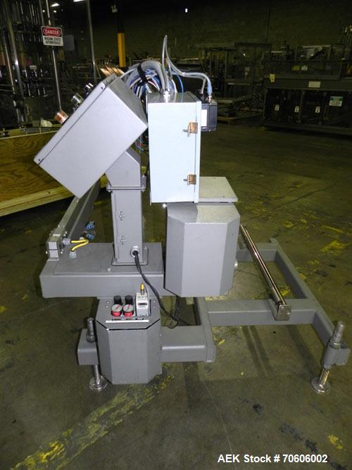 Used Douglas Contour Model M-75 Multi-Pack Shrink Bundler capable of speeds up to 75 cycles per minute. Now configured for print registered film, unsupported 8 oz and 11 oz bottles in multiple lanes,...