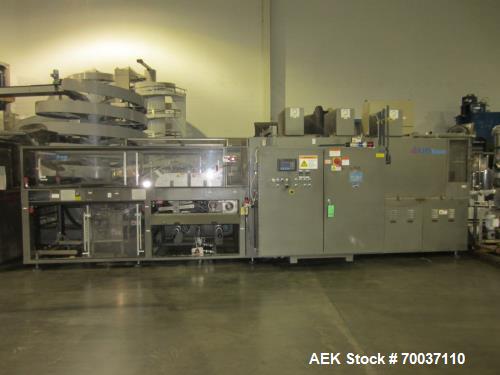 Used KHS Kisters, Model 601P Tray Shrink Wrap Bundler for printed film with 24 in. x 10 ft. x 15 in. High Shrink Tunnel. Has Allen-Bradley Logix 5555 PLC and Panelview 550 touch screen controls. Elec...