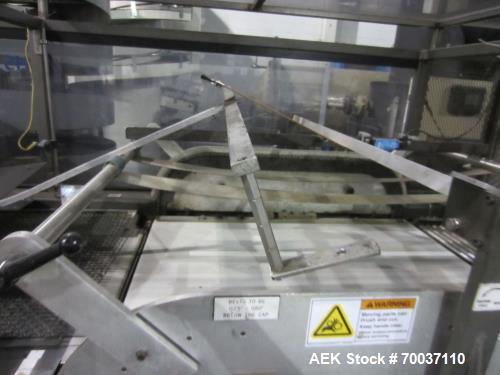 Used KHS Kisters, Model 601P Tray Shrink Wrap Bundler for printed film with 24 in. x 10 ft. x 15 in. High Shrink Tunnel. Has Allen-Bradley Logix 5555 PLC and Panelview 550 touch screen controls. Elec...