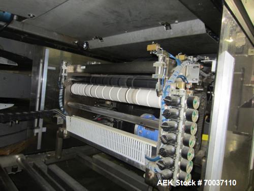 Used KHS Kisters, Model 601P Tray Shrink Wrap Bundler for printed film with 24 in. x 10 ft. x 15 in. High Shrink Tunnel. Has Allen-Bradley Logix 5555 PLC and Panelview 550 touch screen controls. Elec...