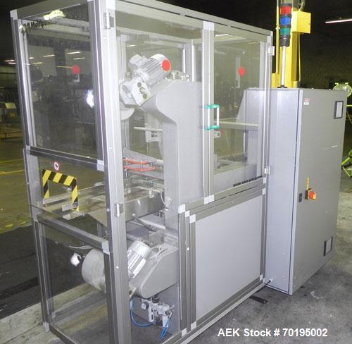 Used Multipack Model F-40 Carton Multi-Pack Stretch Or Shrink Film Bundler. Bundled package size range of Length- 30mm-350mm, Width- 12mm -200.., Height- 50mm -300. Cartons are received on infeed bel...