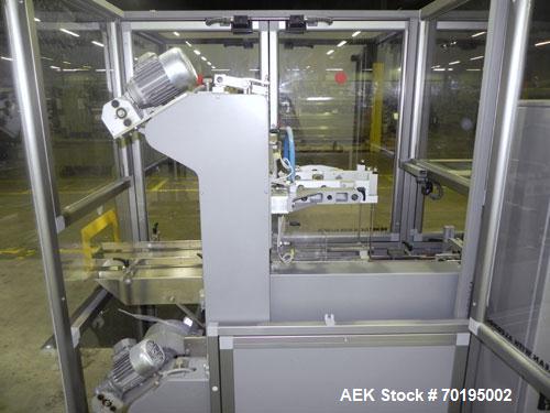 Used Multipack Model F-40 Carton Multi-Pack Stretch Or Shrink Film Bundler. Bundled package size range of Length- 30mm-350mm, Width- 12mm -200.., Height- 50mm -300. Cartons are received on infeed bel...