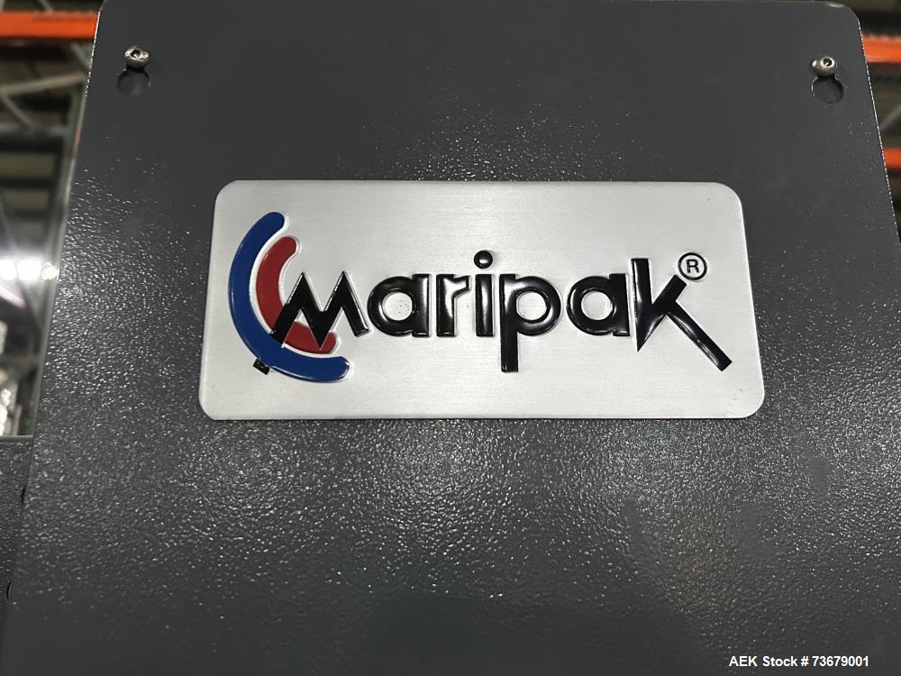 Used Maripak Bundler/Bander, Model Multimac 60D Servo. Up to 35 cycles/minute. 16" (400mm) seal bar opening. 65'/minute maximum conveyor speed. 14" maximum roll diameter (adjustable). 38" working hei...