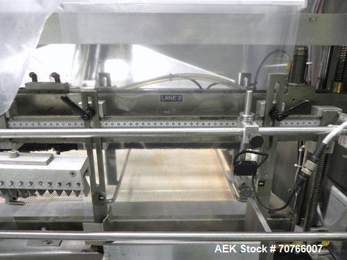 Used Omega Design Model DL-36 Dual Lane High Speed Shrink Bundler. Capable of speeds from 200 - 240 containers per minute. Is of stainless steel construction. Max product height: up to 11". Max film ...