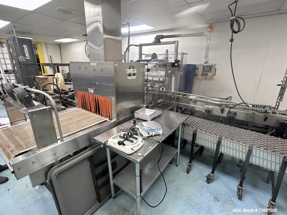 Used Omega Design Model DL-27 Dual Lane Shrink Bundler. Machine is capable of speeds from 200 to 240 bottles per minute (depending on product size and infeed pattern). Designed for dual main product ...