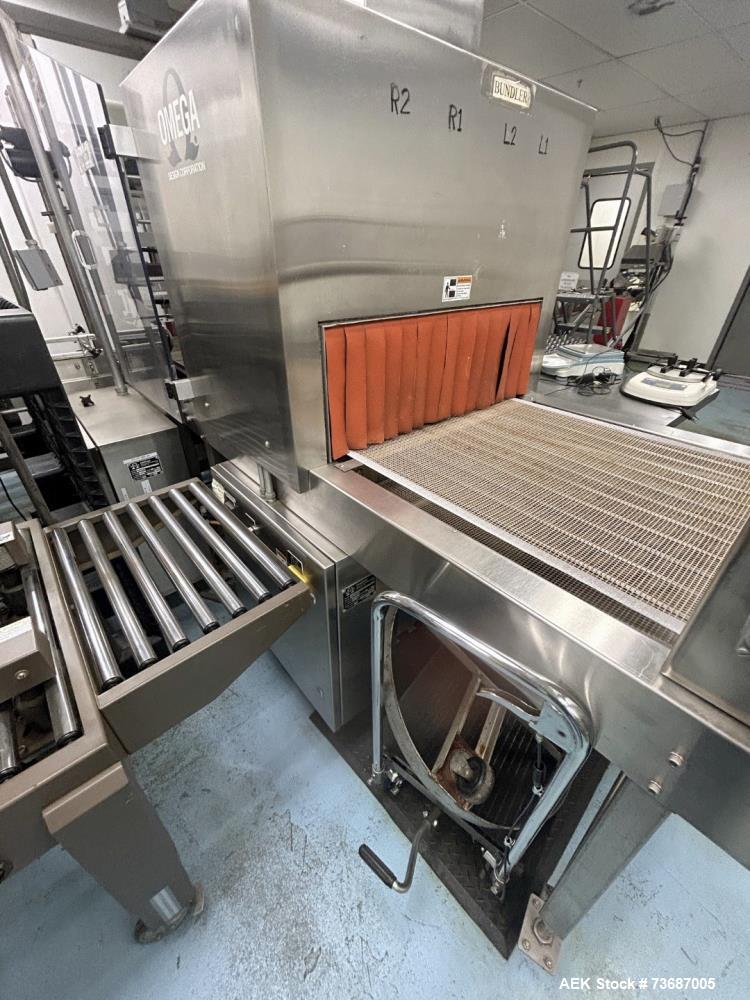 Used Omega Design Model DL-27 Dual Lane Shrink Bundler. Machine is capable of speeds from 200 to 240 bottles per minute (depending on product size and infeed pattern). Designed for dual main product ...