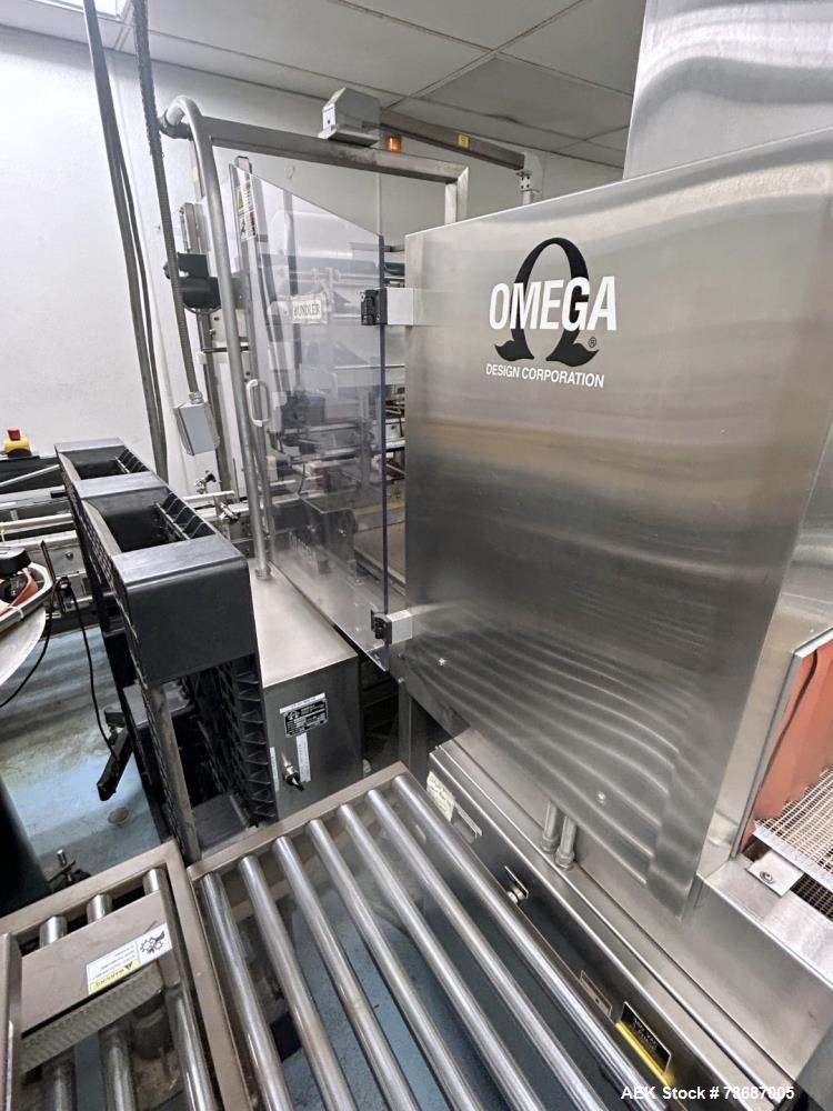 Used Omega Design Model DL-27 Dual Lane Shrink Bundler. Machine is capable of speeds from 200 to 240 bottles per minute (depending on product size and infeed pattern). Designed for dual main product ...