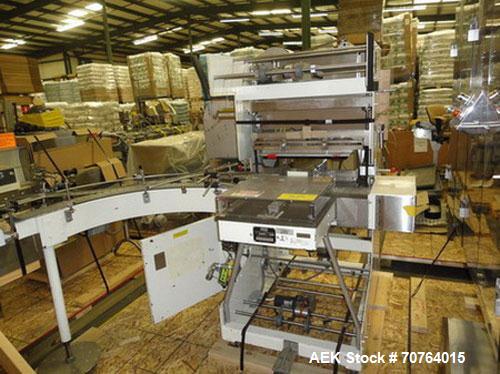 Used Omega Design Model SL-18 Shrink Bundler capable of speeds from 120 - 150 containers per minute depending on container size and pack pattern. Single lane unit with right angle infeed and integrat...