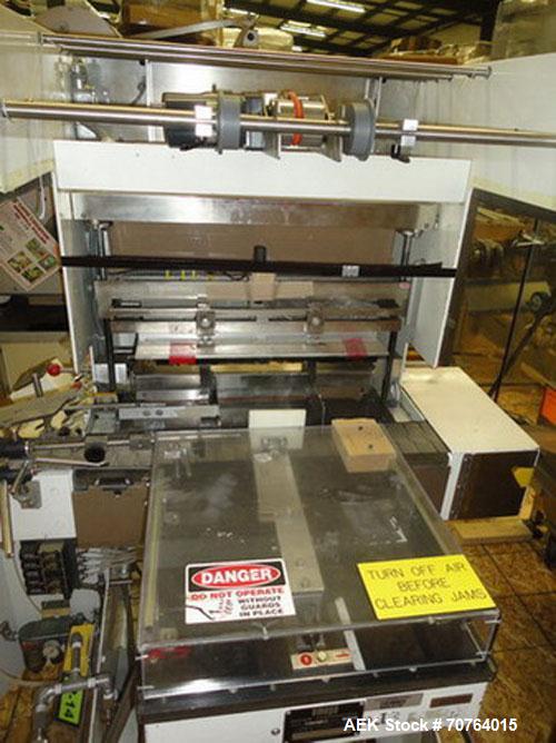Used Omega Design Model SL-18 Shrink Bundler capable of speeds from 120 - 150 containers per minute depending on container size and pack pattern. Single lane unit with right angle infeed and integrat...