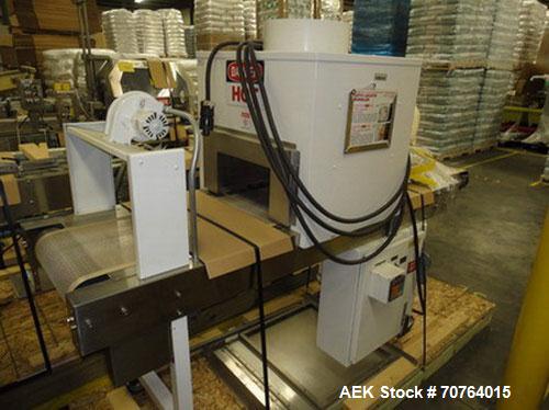 Used Omega Design Model SL-18 Shrink Bundler capable of speeds from 120 - 150 containers per minute depending on container size and pack pattern. Single lane unit with right angle infeed and integrat...