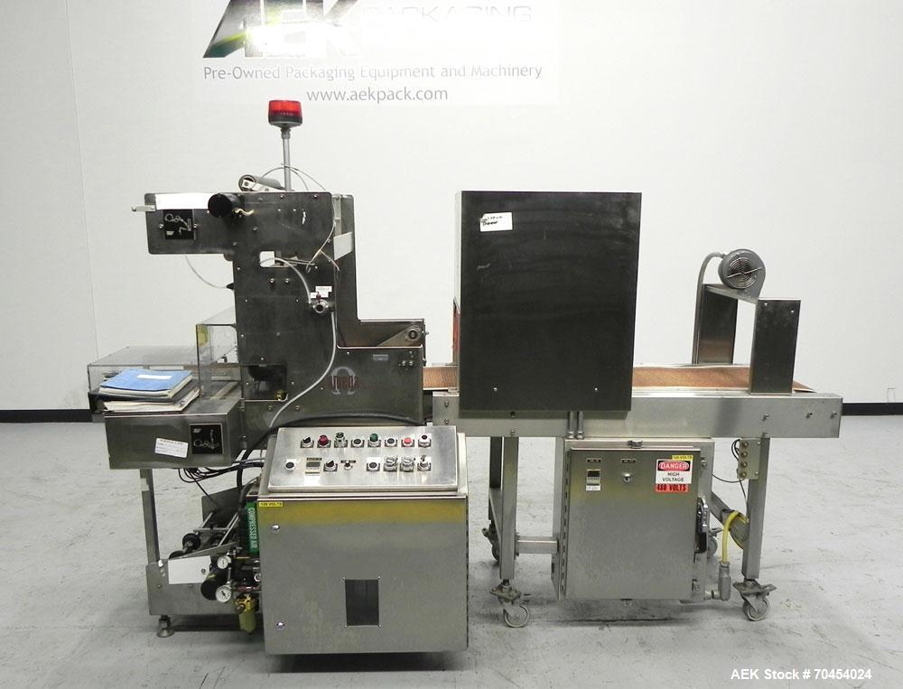 Used Omega Design Model SL-18 Single Lane Shrink Bundler. Machine is capable of speeds from 120 to 150 containers per minute. Has right angle infeed and integrated heat shrink tunnel. Has a maximum f...