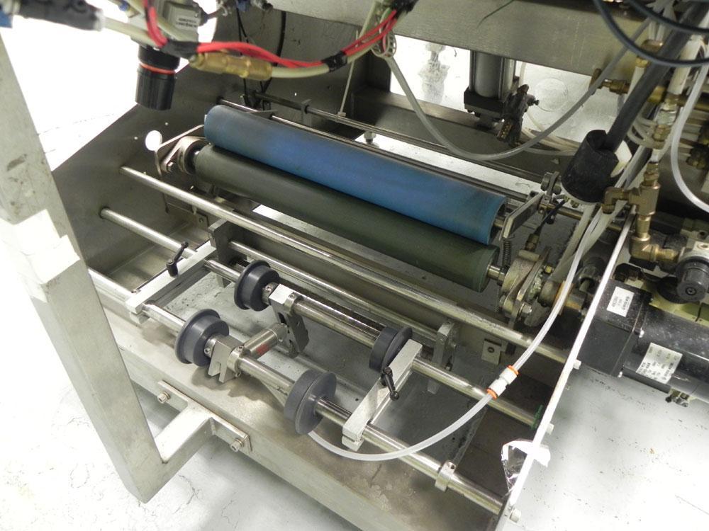 Used Omega Design Model SL-18 Single Lane Shrink Bundler. Machine is capable of speeds from 120 to 150 containers per minute. Has right angle infeed and integrated heat shrink tunnel. Has a maximum f...