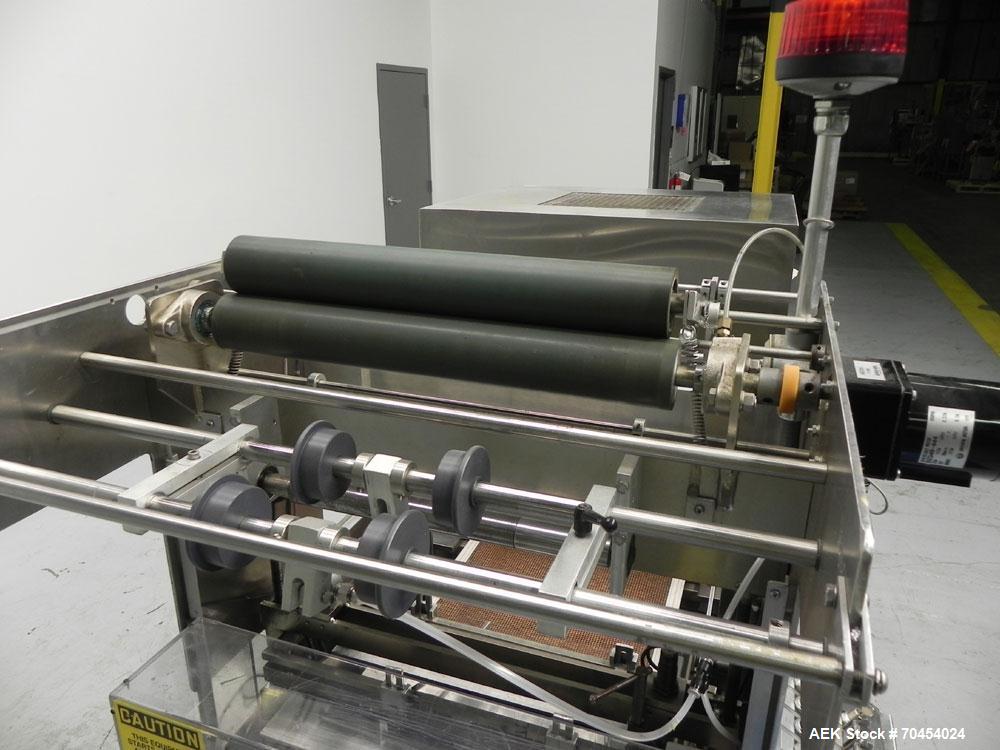 Used Omega Design Model SL-18 Single Lane Shrink Bundler. Machine is capable of speeds from 120 to 150 containers per minute. Has right angle infeed and integrated heat shrink tunnel. Has a maximum f...