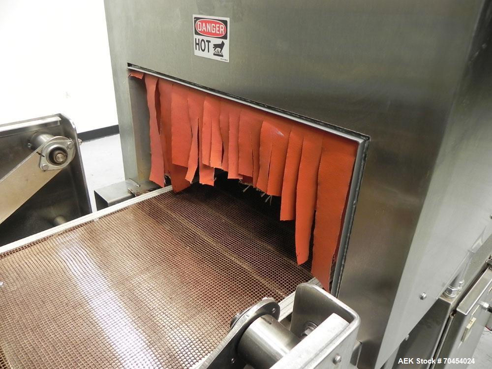 Used Omega Design Model SL-18 Single Lane Shrink Bundler. Machine is capable of speeds from 120 to 150 containers per minute. Has right angle infeed and integrated heat shrink tunnel. Has a maximum f...