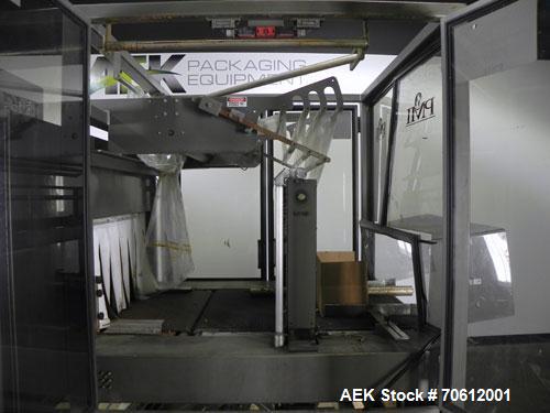 Used PMI Model SIC-30 Automatic Shrink Bundler & Shrink Tunnel. Machine is rated at up to 30 packages per minute. Tray wrapper has a30" seal bar. Has a glass-filled/nylon mech conveyor belt. Has a hi...