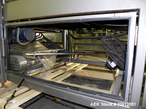 Used PMI Model SIC-30 Automatic Shrink Bundler & Shrink Tunnel. Machine is rated at up to 30 packages per minute. Tray wrapper has a30" seal bar. Has a glass-filled/nylon mech conveyor belt. Has a hi...