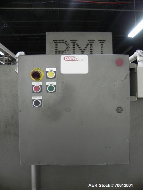 Used PMI Model SIC-30 Automatic Shrink Bundler & Shrink Tunnel. Machine is rated at up to 30 packages per minute. Tray wrapper has a30" seal bar. Has a glass-filled/nylon mech conveyor belt. Has a hi...