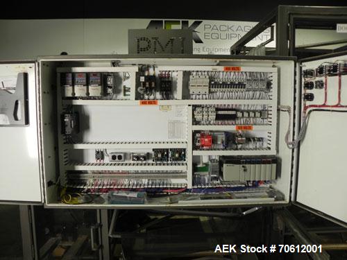 Used PMI Model SIC-30 Automatic Shrink Bundler & Shrink Tunnel. Machine is rated at up to 30 packages per minute. Tray wrapper has a30" seal bar. Has a glass-filled/nylon mech conveyor belt. Has a hi...
