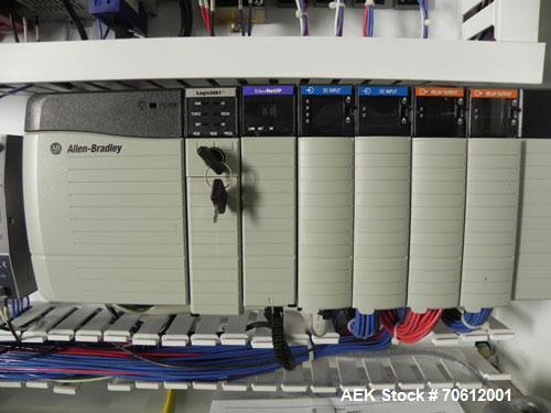 Used PMI Model SIC-30 Automatic Shrink Bundler & Shrink Tunnel. Machine is rated at up to 30 packages per minute. Tray wrapper has a30" seal bar. Has a glass-filled/nylon mech conveyor belt. Has a hi...