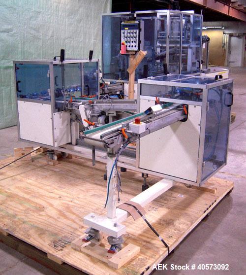 Used Skinetta ASK 450T Shrink Bander/Bundler. Capable of speeds from 10 to 40 cycles per minute. Has inline feed and optional right angle carton collator. Max 450mm web width. Has upstacker. Last use...