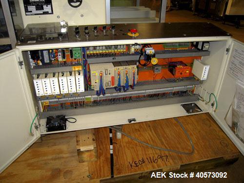 Used Skinetta ASK 450T Shrink Bander/Bundler. Capable of speeds from 10 to 40 cycles per minute. Has inline feed and optional right angle carton collator. Max 450mm web width. Has upstacker. Last use...