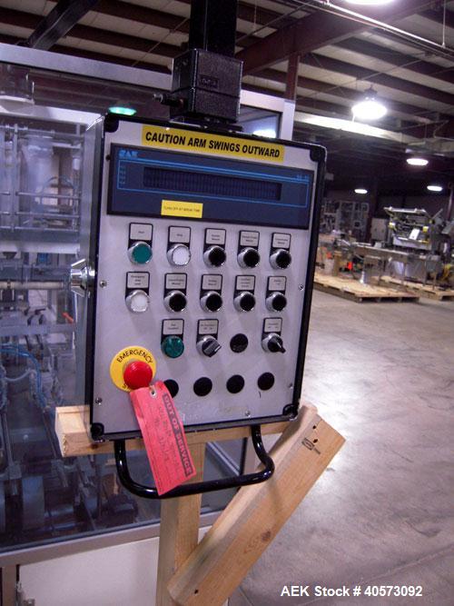 Used Skinetta ASK 450T Shrink Bander/Bundler. Capable of speeds from 10 to 40 cycles per minute. Has inline feed and optional right angle carton collator. Max 450mm web width. Has upstacker. Last use...
