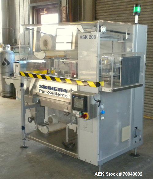 Used Skinetta Automatic Stretch Banding/ Shrink Bundle Machine, Model ASK200B, Serial #2517.02. Capable of speeds up to 20 cycles per minute. Will handle working film web width of 200 mm. Handles PE ...
