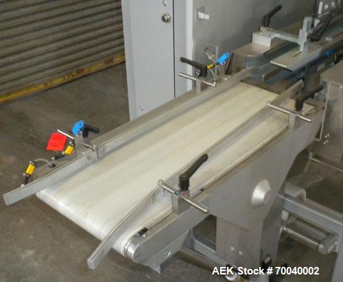 Used Skinetta Automatic Stretch Banding/ Shrink Bundle Machine, Model ASK200B, Serial #2517.02. Capable of speeds up to 20 cycles per minute. Will handle working film web width of 200 mm. Handles PE ...