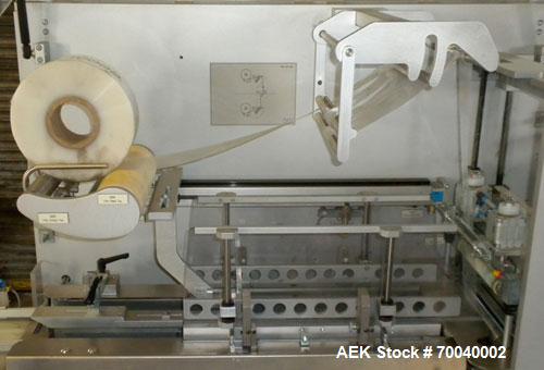 Used Skinetta Automatic Stretch Banding/ Shrink Bundle Machine, Model ASK200B, Serial #2517.02. Capable of speeds up to 20 cycles per minute. Will handle working film web width of 200 mm. Handles PE ...