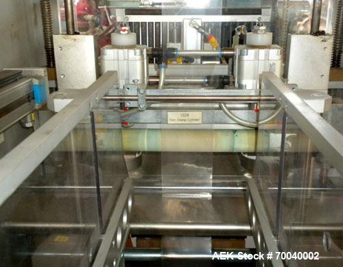 Used Skinetta Automatic Stretch Banding/ Shrink Bundle Machine, Model ASK200B, Serial #2517.02. Capable of speeds up to 20 cycles per minute. Will handle working film web width of 200 mm. Handles PE ...