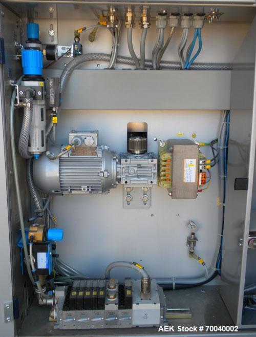 Used Skinetta Automatic Stretch Banding/ Shrink Bundle Machine, Model ASK200B, Serial #2517.02. Capable of speeds up to 20 cycles per minute. Will handle working film web width of 200 mm. Handles PE ...