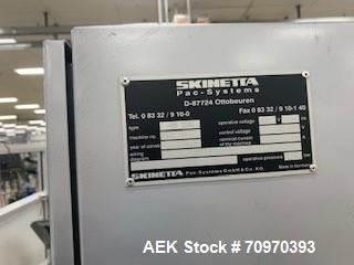 Used Skinetta (Christ Packaging) Model ASK2500 Shrink Bundler with Shrink Tunnel. Capable of speeds up to 40 cycles per minute. Maximum sealing width: up to 230mm. Maximum bundle height: up to 240mm....