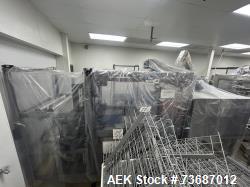 Used EDL Model Side Feed Automatic Stainless Steel Shrink Bundler with Integrated Heat Shrink Tunnel.