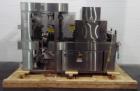 Used API Stainless Steel Pharmaceutical Shrink Bundler, Model Duratech 2000 S-PH. Integrated heat tunnel. Capable of up to 100 round or rectangular shaped containers depending on pattern and size. Si...