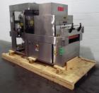 Used API Stainless Steel Pharmaceutical Shrink Bundler, Model Duratech 2000 S-PH. Integrated heat tunnel. Capable of up to 100 round or rectangular shaped containers depending on pattern and size. Si...