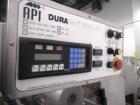 Used API Stainless Steel Pharmaceutical Shrink Bundler, Model Duratech 2000 S-PH. Integrated heat tunnel. Capable of up to 100 round or rectangular shaped containers depending on pattern and size. Si...