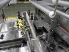 Used API Model DuraTech 2000-S-PH Pharmaceutical Shrink Bundler. Machine is capable of speeds up to 100 bottles/packages per minute (depending on pattern and size). Can handle containers up to 8