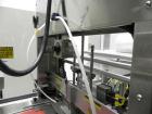 Used API Model DuraTech 2000-S-PH Pharmaceutical Shrink Bundler. Machine is capable of speeds up to 100 bottles/packages per minute (depending on pattern and size). Can handle containers up to 8