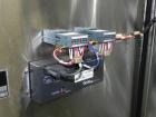 Used API Model DuraTech 2000-S-PH Pharmaceutical Shrink Bundler. Machine is capable of speeds up to 100 bottles/packages per minute (depending on pattern and size). Can handle containers up to 8