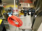 Used API Model DuraTech 2000-S-PH Pharmaceutical Shrink Bundler. Machine is capable of speeds up to 100 bottles/packages per minute (depending on pattern and size). Can handle containers up to 8