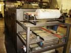 Used American Packaging Machinery (APM) Automatic Inline Shrink Bundler, Series MIF. Designed for trayed products. Capable of speeds up to 45 trays per minute. Intermittent motion unit with integrate...