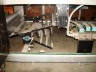Used American Packaging Machinery (APM) Automatic Inline Shrink Bundler, Series MIF. Designed for trayed products. Capable of speeds up to 45 trays per minute. Intermittent motion unit with integrate...