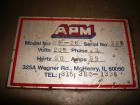 Used American Packaging Machinery (APM) Automatic Inline Shrink Bundler, Series MIF. Designed for trayed products. Capable of speeds up to 45 trays per minute. Intermittent motion unit with integrate...