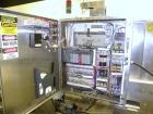 Used Arpac Model 108-28SS Automatic Right Angle Stainless Steel Shrink Bundler. Capable of speeds up to 30 bundles per minute. Package size range: height up to 10