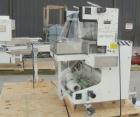 Used Omega Design DL-27 Dual Lane Shrink Bundler. Capable of speeds up to 240 BPM. Maximum product height 11