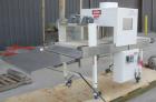 Used Omega Design DL-27 Dual Lane Shrink Bundler. Capable of speeds up to 240 BPM. Maximum product height 11