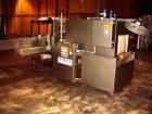 Used Dorell Sleeve Wrapper, Model SW20AICST1220. Automatic right angle with integrated tunnel rated up to 20 bundles per minute. Features 20