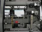 Used Douglas Contour Model M-75 Multi-Pack Shrink Bundler capable of speeds up to 75 cycles per minute. Now configured for print registered film, unsupported 8 oz and 11 oz bottles in multiple lanes,...