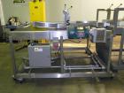 Used Douglas Contour Model M-75 Multi-Pack Shrink Bundler capable of speeds up to 75 cycles per minute. Now configured for print registered film, unsupported 8 oz and 11 oz bottles in multiple lanes,...