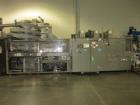 Used KHS Kisters, Model 601P Tray Shrink Wrap Bundler for printed film with 24 in. x 10 ft. x 15 in. High Shrink Tunnel. Has Allen-Bradley Logix 5555 PLC and Panelview 550 touch screen controls. Elec...